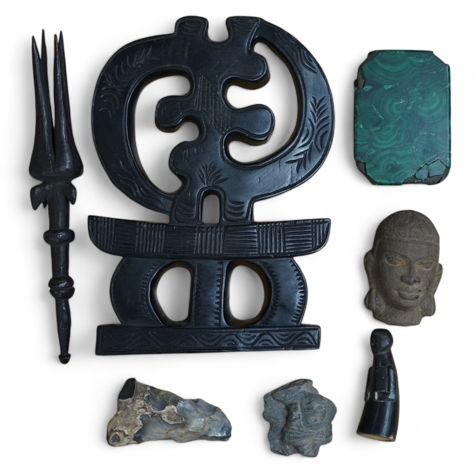 A flint axe, an inuit horn carving, a South American tribal stone head, a malachite panel, another stone carving and Chinese stand, largest 32cm. Condition - varies